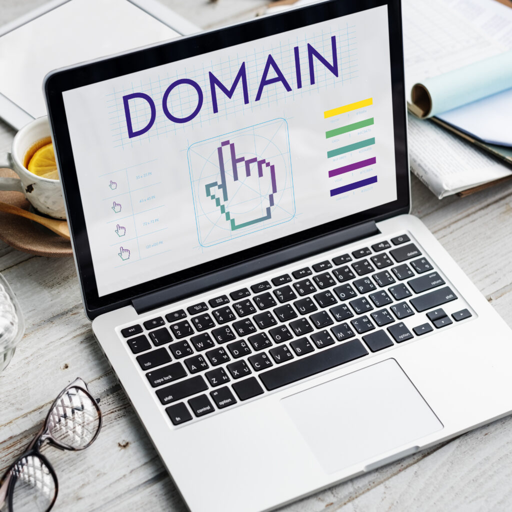 Laptop screen displaying a domain design concept for website branding and SEO.