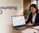 Malaysian accountant reviewing SEO analytics beside tax papers and a calculator.