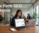 A solicitor reviews analytics beside a smartphone in a bright modern law office.