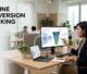 Strategist viewing ad leads and sales stages on a laptop in a bright office.