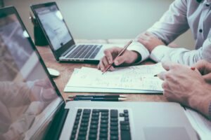 Person reviewing a business website assessment at a laptop