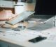 Technical SEO audit workspace with laptop and calculator